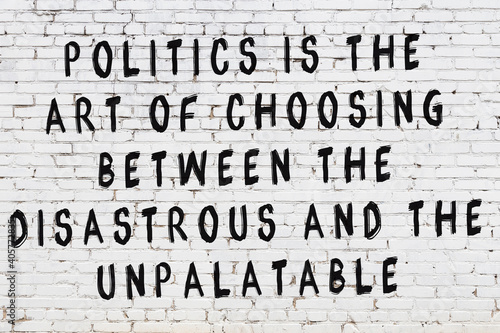 Black painted inscription of smart quote on white brick wall