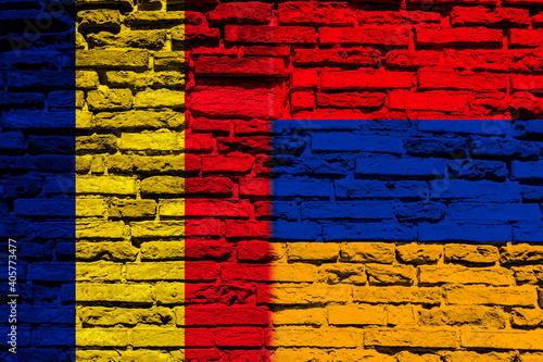 Flag of Chad and Armenia on brick wall