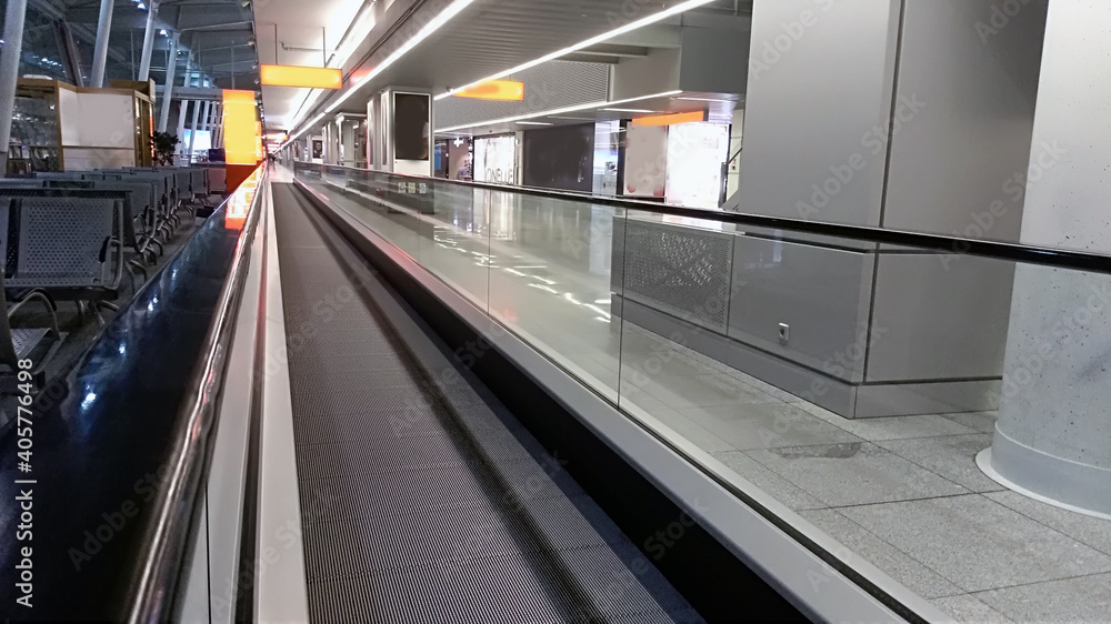 horizontal escalator at the airport/ details of a slidewalk, or moveator at an airport. horizontal escalator at the airport/ details of a slidewalk, or moveator at an airport.