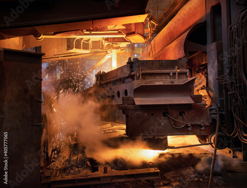 Steel production in electric furnaces. Sparks of molten steel. Electric arc furnace shop . Metallurgical production, heavy industry, engineering, steelmaking