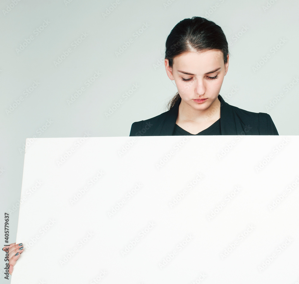 young pretty brunette girl with placard shit copyspace on white background wearing business costume student young pretty brunette girl with placard shit copyspace on white background wearing business costume student