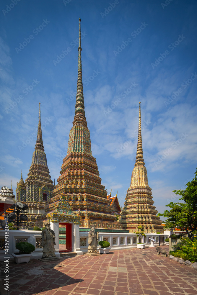 Beautiful stupas decorated with colorful mosaic big pagoda and Thai art architecture of Wat Pho temple in Bangkok, Thailand.