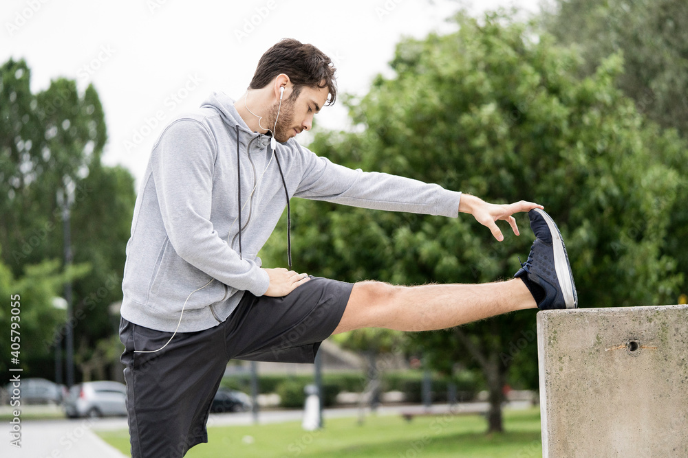 Young man exercising in public park Young man exercising in public park