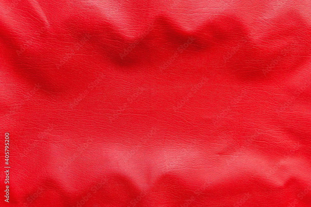 Wavy texture of red faux leather background, close-up Wavy texture of red faux leather background, close-up