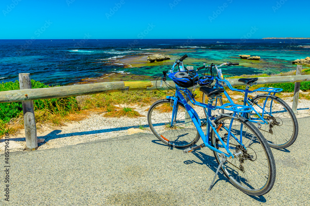 Tourist bicycles parked at Parker Point, a lookout overlooking tropical and pristine white beaches of Western Australia's Rottnest Island, a popular summer holiday destination near Perth.