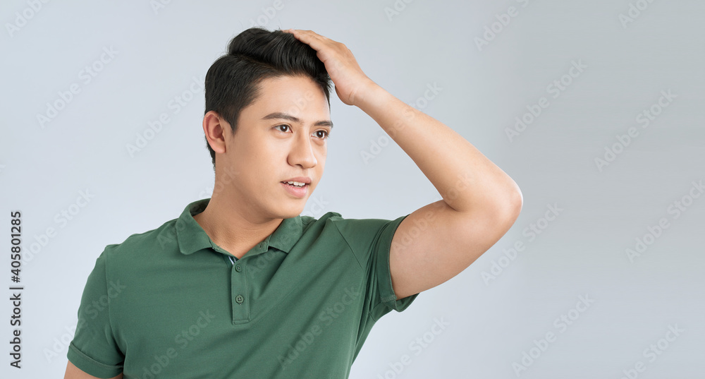 Handsome man touching his hair close up portrait studio on white background Handsome man touching his hair close up portrait studio on white background