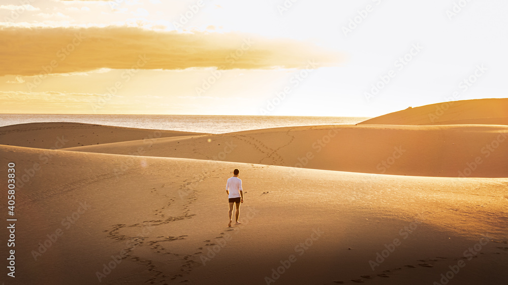 Obraz premium Young man walking in the runes in Gran Canaria in Spain during Covid