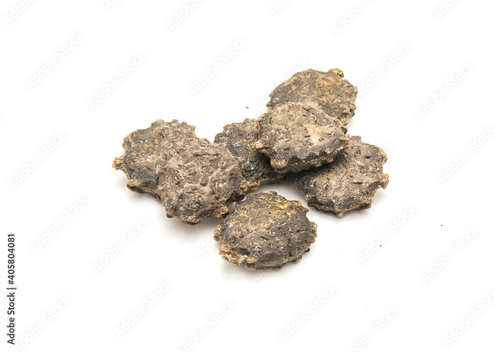 Pile of gac seeds (momordica cochinchinensis) isolated on white background