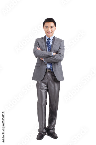 Portrait of young businessman standing in white background 