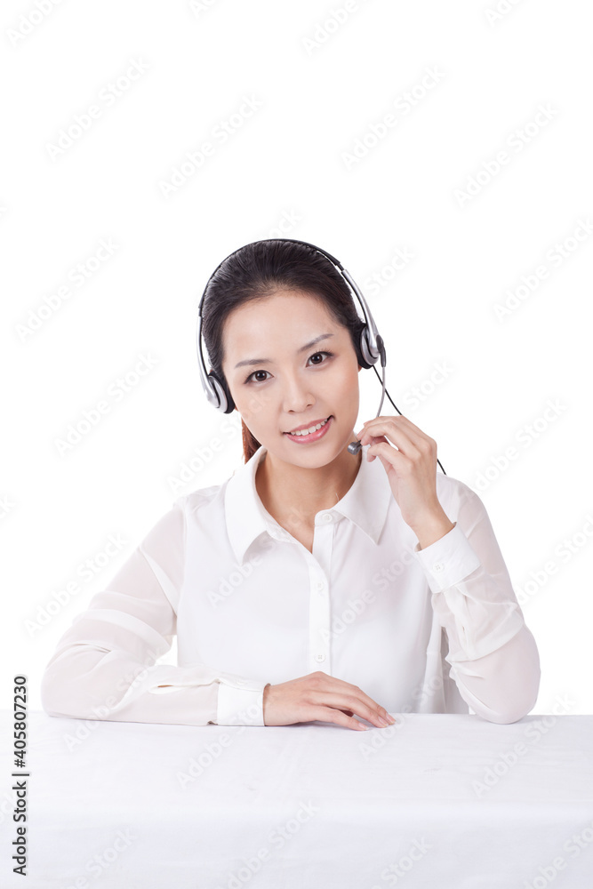 Portrait of Female office worker wearing headset Portrait of Female office worker wearing headset