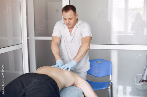 Massage doctor. The man is undergoing rehabilitation