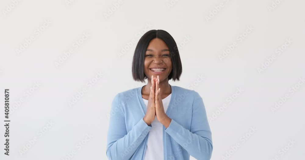 Excited woman clapping hands and cheering over white background Excited woman clapping hands and cheering over white background
