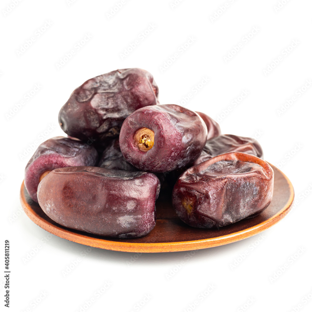 Dried organic date fruits in a plate, isolated on white background Dried organic date fruits in a plate, isolated on white background