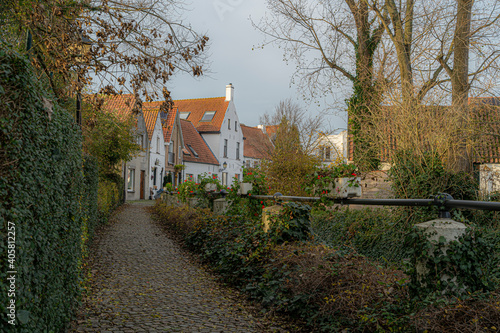 Lissewege a town between Bruges and Knokke.  Idyllic picture of a town.  Beautifull authentic small town with an idyllic atmosphere great for bikers and walkers toerism.  Best of belgium with colours. photo