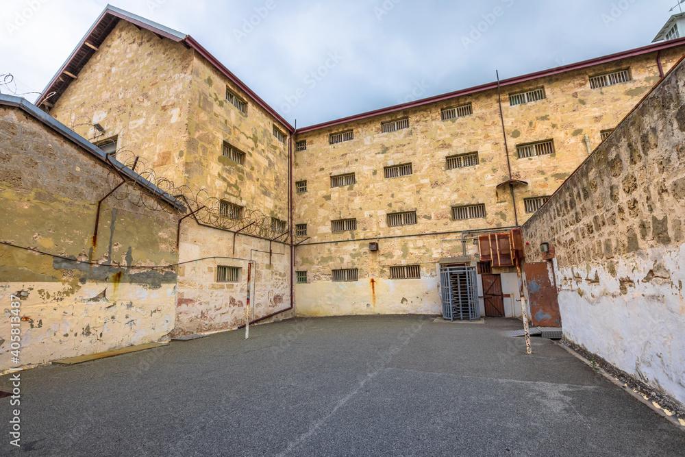 courtyard with barbed wire of Fremantle Prison historic building, UNESCO World Heritage and one of most notorious prisons in British Empire. Fremantle is port city of Perth in Western Australia.
