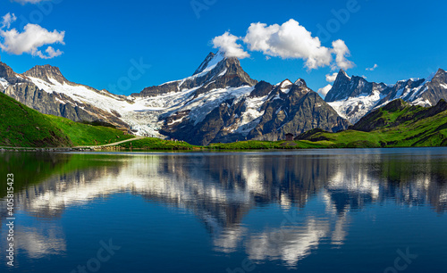Sunrise  view on Bernese range above Bachalpsee lake. Popular tourist attraction. Location place Swiss alps, Grindelwald valley, Europe. 