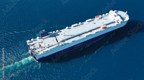 Aerial drone photo of Large RoRo (Roll on-off) car transportation vessel cruising the Mediterranean deep blue sea © aerial-drone