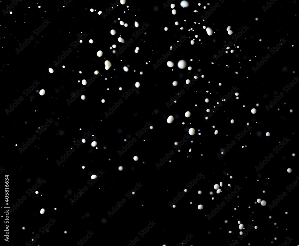 Splashes of white milk isolated on a black background. Splashes of white milk isolated on a black background.