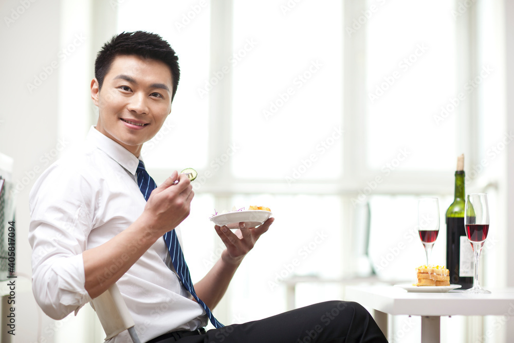 Portrait of businessman eating salad at desk Portrait of businessman eating salad at desk