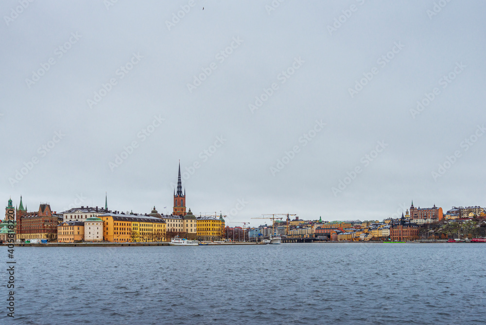 A panoramic view on shoreline in Stockholm from Stadshusparken view point on a cloudy winter day