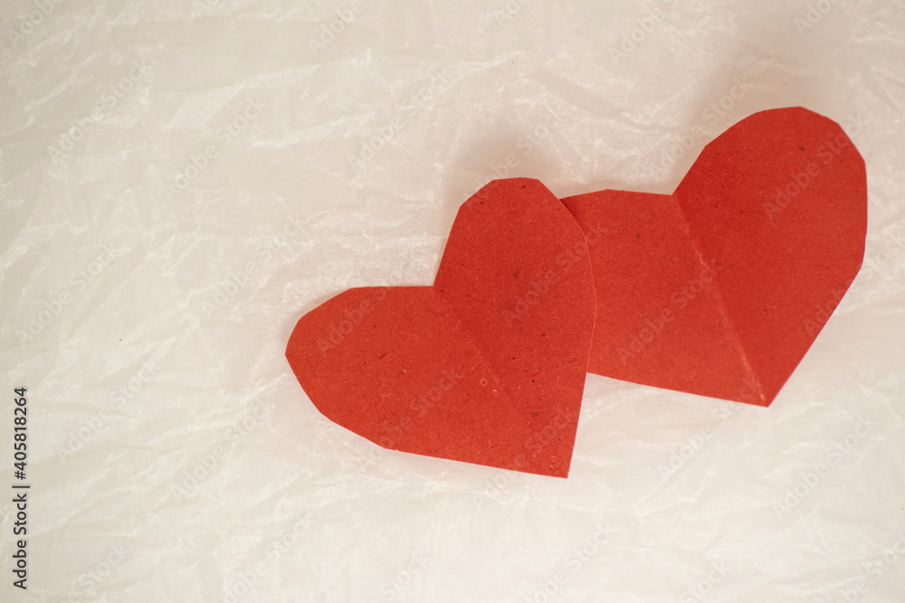 Fototapeta premium valentine's day cards on white crumpled paper. valentines on a crumpled background with a place for an inscription