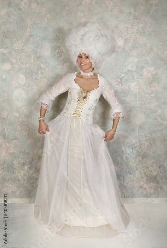 Lady dressed in baroque style clothes in the studio