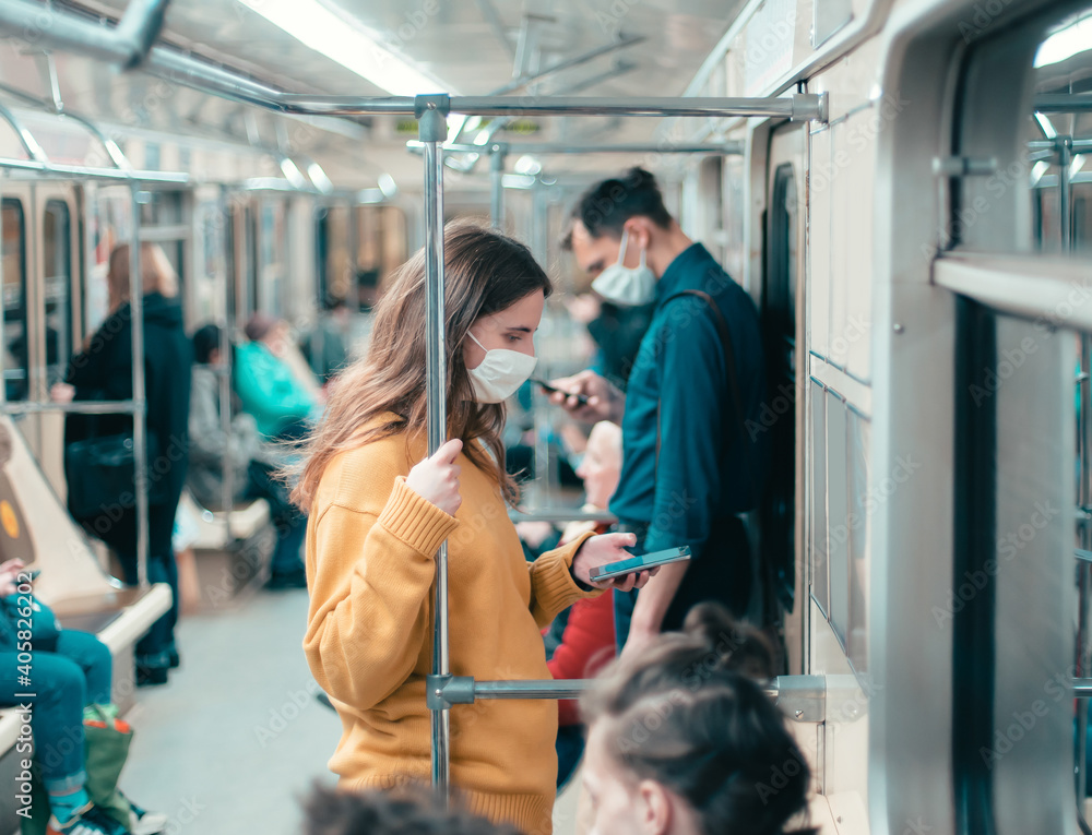 variety of passengers ride the subway car variety of passengers ride the subway car