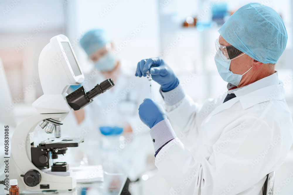 close up. scientist microbiologist working in the laboratory. close up. scientist microbiologist working in the laboratory.