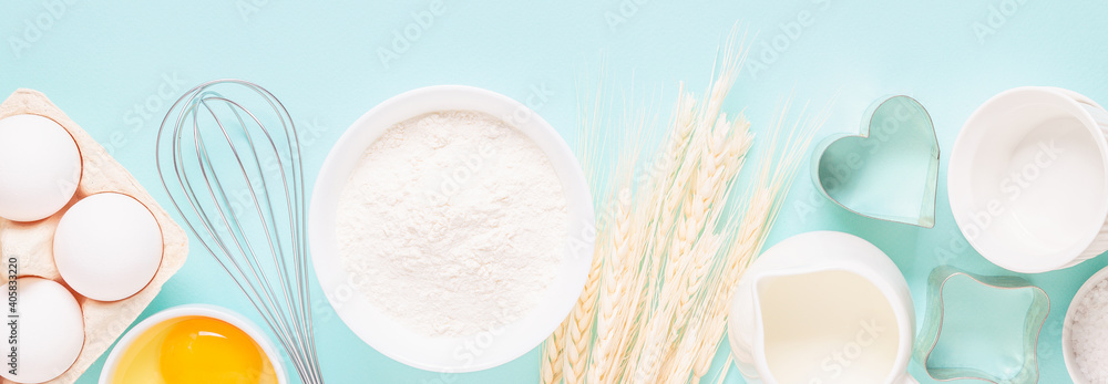 Ingredients for baking on light blue background. Ingredients for baking on light blue background.
