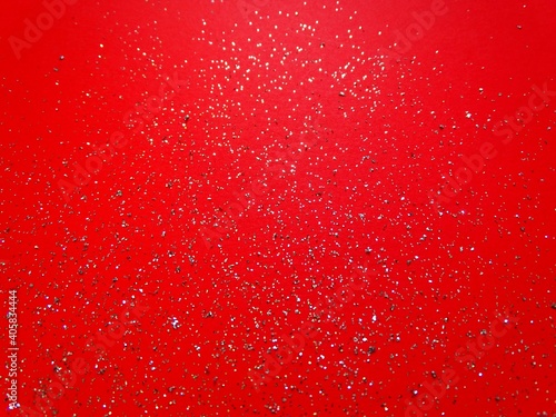 festive red background with silver glitter