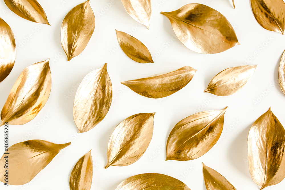 Pattern, texture with gold leaves isolated on white background. flat lay, top view Pattern, texture with gold leaves isolated on white background. flat lay, top view