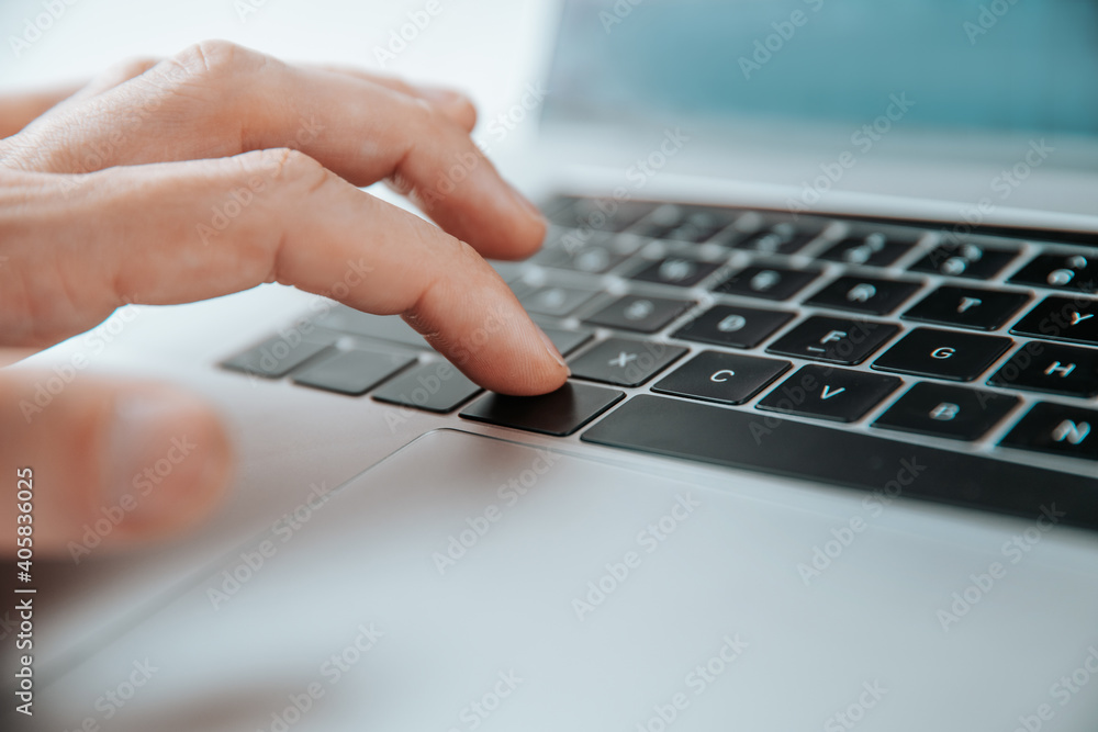close up. man pressing the command key on his laptop. close up. man pressing the command key on his laptop.