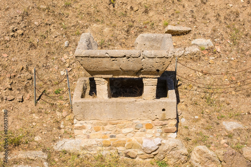 The ruins of  an overlapping fountain along the Paved Etruscan Road in Roselle or Rusellae, an ancient Etruscan and Roman city in Tuscany photo