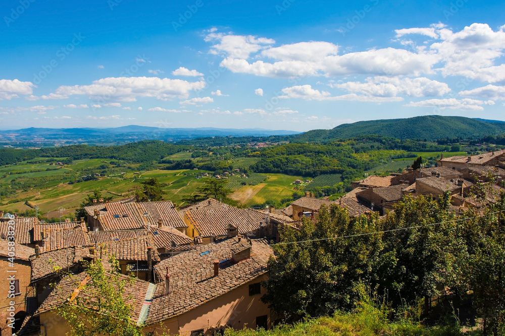 The late summer landscape around Montepulciano in Val d'Orcia, Siena Province, Tuscany, Italy. Seen from above the town's rooftops
