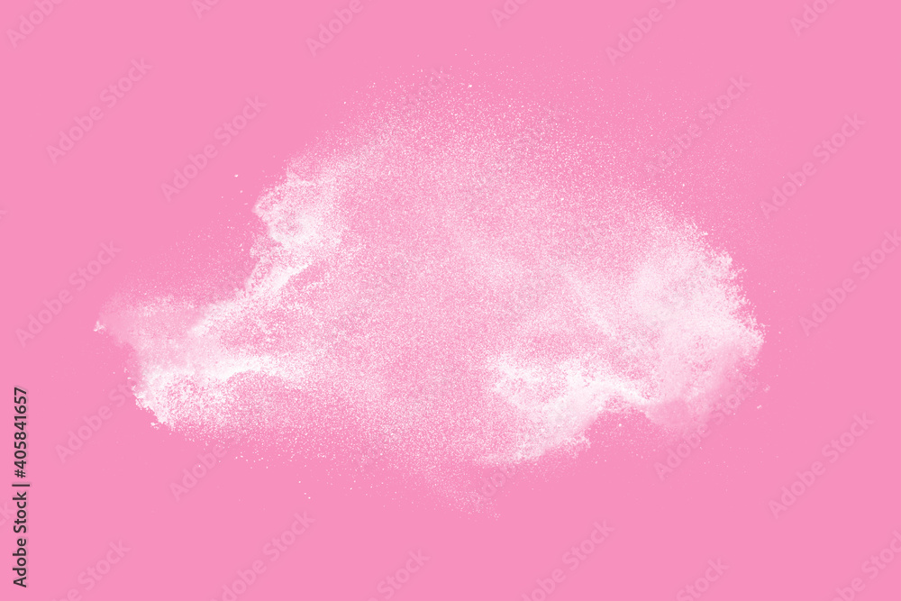 Closeup of white dust particle splash isolated on pink  background. Powder explosion.