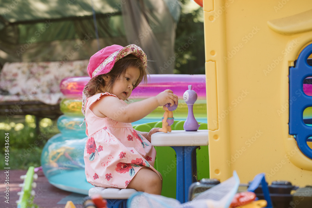 Little girl walking on the playground Little girl walking on the playground