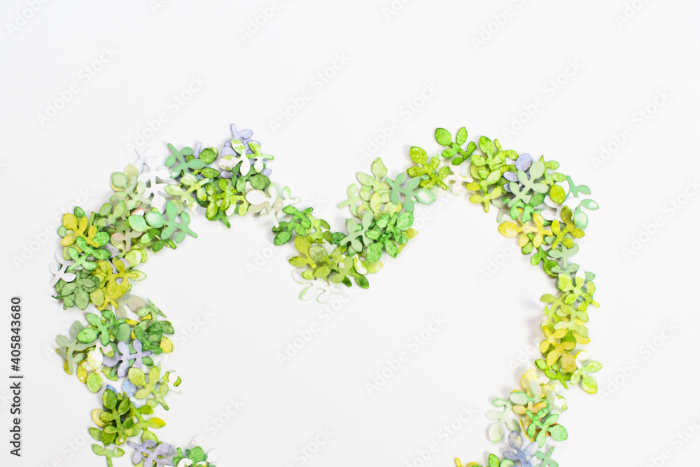 Green leaves of paper, folded in one big heart on a white background, as festive feelings on Valentine's Day, love.
View from above. Copyspace. Green leaves of paper, folded in one big heart on a white background, as festive feelings on Valentine's Day, love.
View from above. Copyspace.