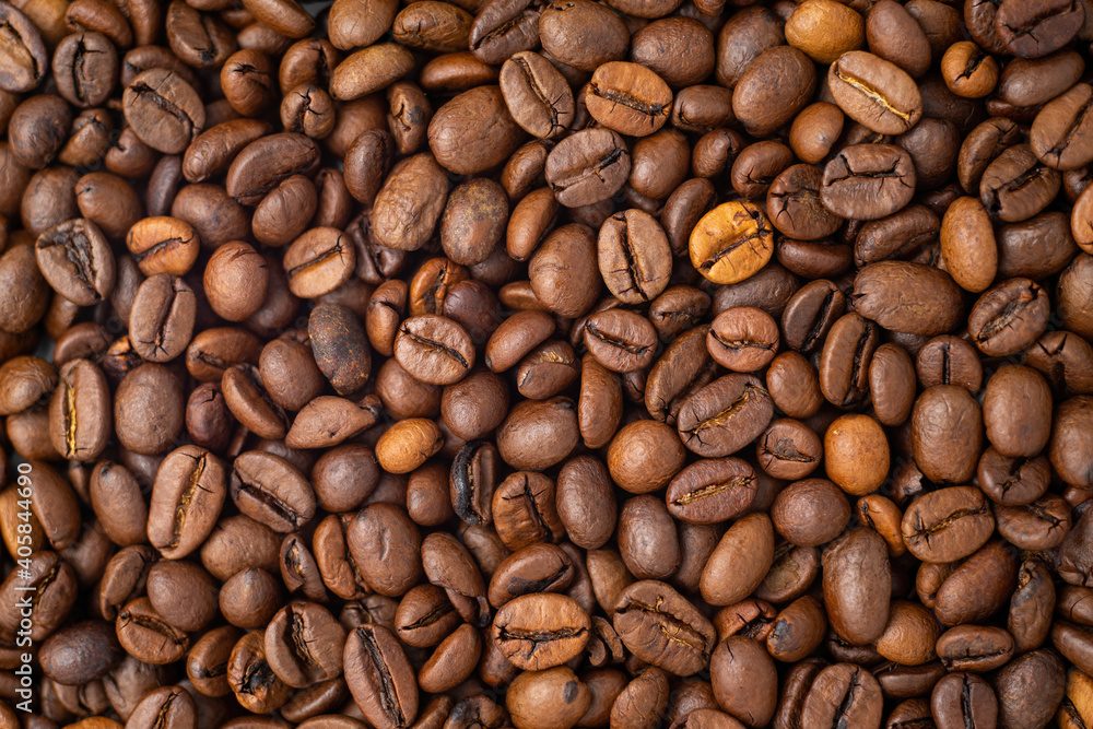 Roasted coffee beans covering the entire picture, creating a nice background. Roasted coffee beans covering the entire picture, creating a nice background.