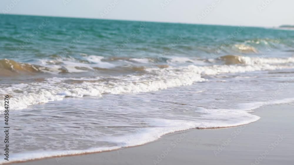 View of the Beautiful sea waves with foam of blue and turquoise color at Beyt Dwarka island in Gujarat, India. Beautiful tropical beach with blue sky with waves crashing empty beach during summer View of the Beautiful sea waves with foam of blue and turquoise color at Beyt Dwarka island in Gujarat, India. Beautiful tropical beach with blue sky with waves crashing empty beach during summer