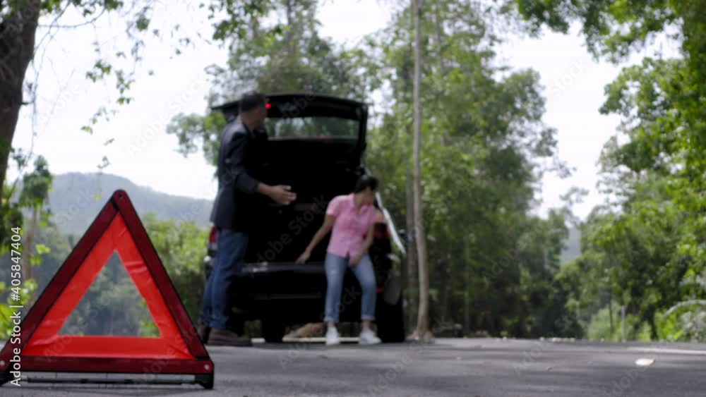 custom made wallpaper toronto digitalClose up red emergency stop sign standing on road. Worried and angry couple walking near his broken car talking on phone with insurance agent. Close up triangle on side road
