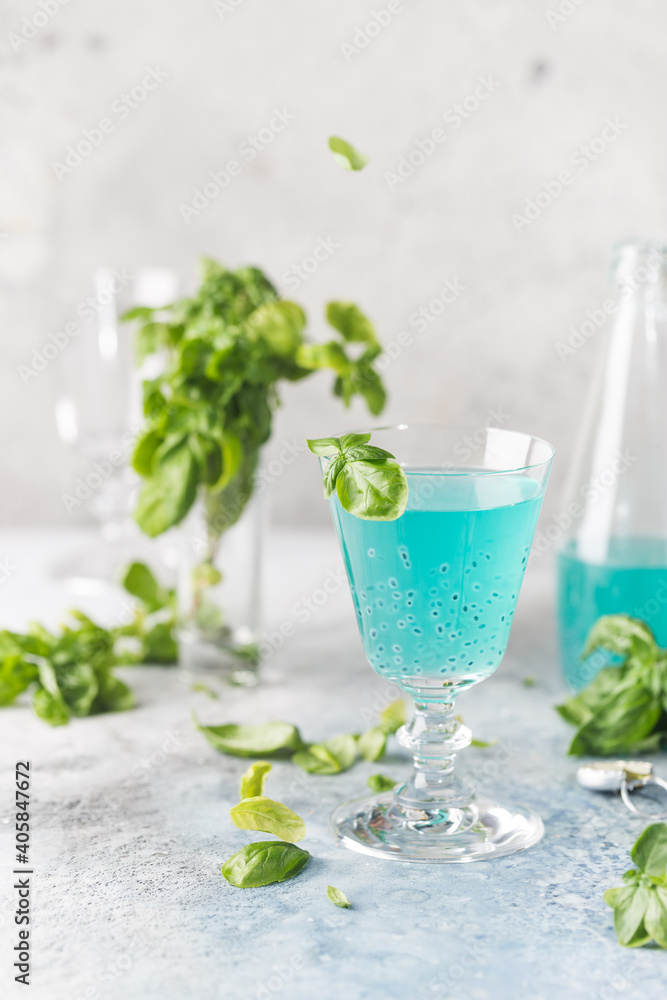 Colorful refreshing summer drink with basil seeds on light background. Colorful refreshing summer drink with basil seeds on light background.