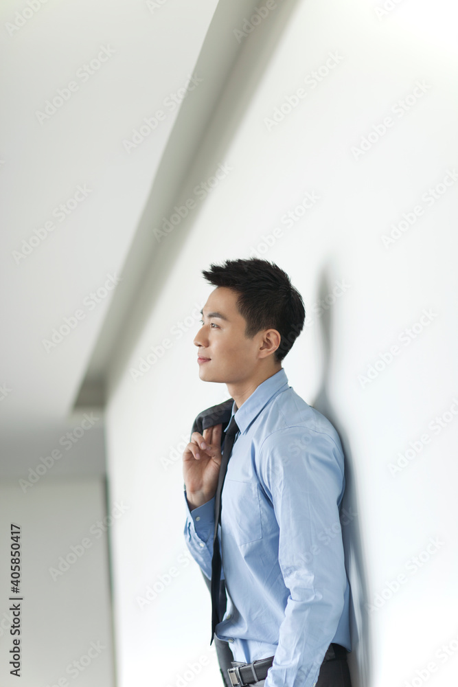 Portrait of young business man in corridor Portrait of young business man in corridor