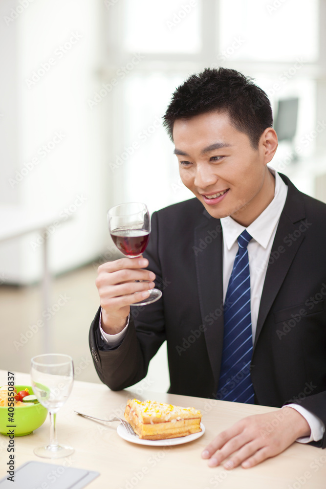 Portrait of businessman at desk with sandwich Portrait of businessman at desk with sandwich