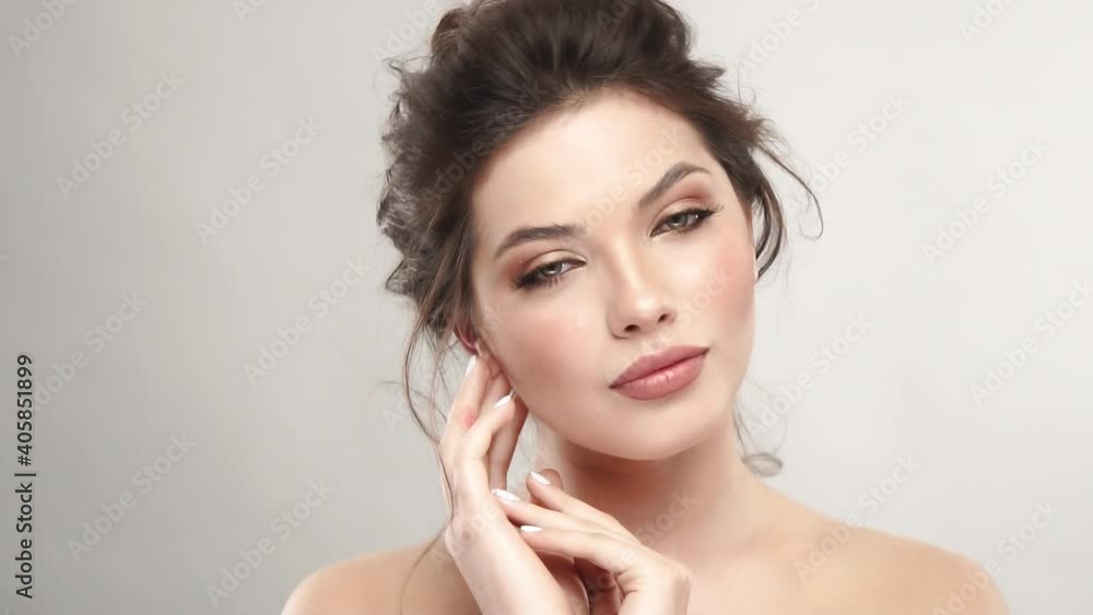 pretty woman touching her face pretty woman touching her face