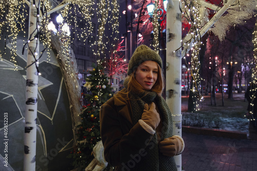 young beautiful happy smiling woman posing on the street.