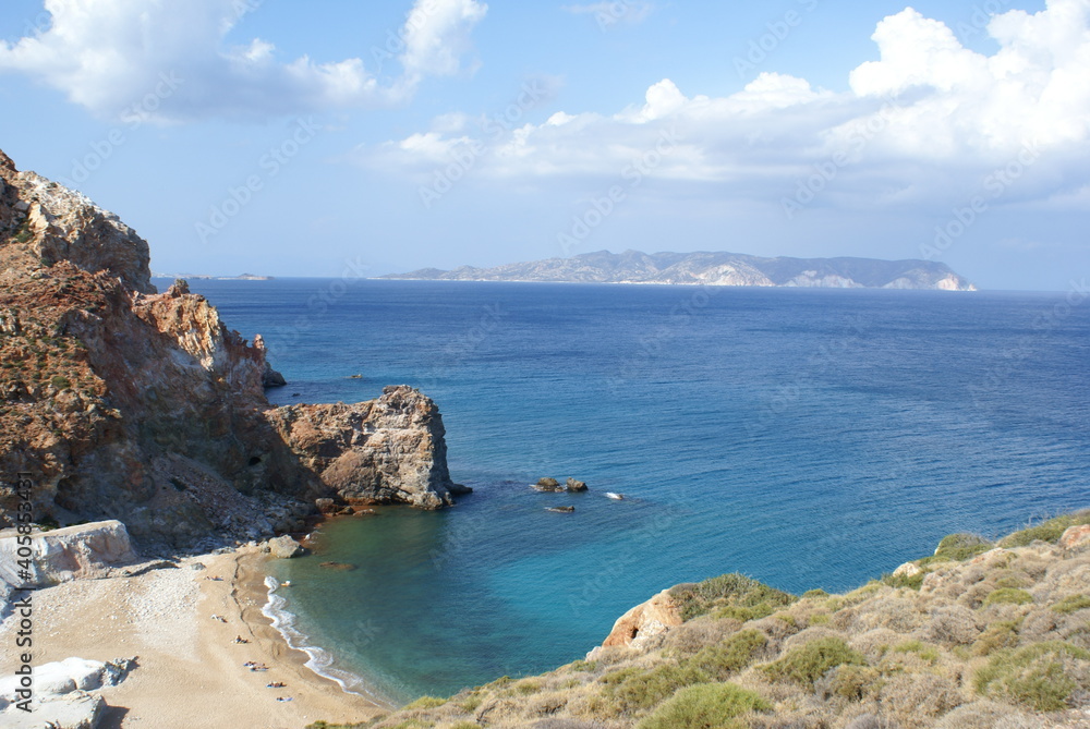 Panoramic view of Paliorema Beach in Milos, Greece. Poliegos island in the background Panoramic view of Paliorema Beach in Milos, Greece. Poliegos island in the background