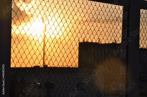 city ​​dawn through the bars