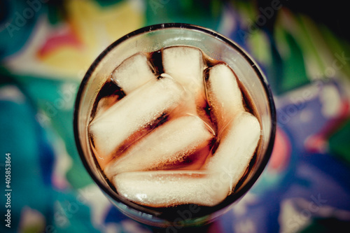 close up of a glass with ice and soda
