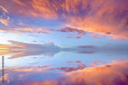 Cumulus sunset clouds with sun setting down © saravut