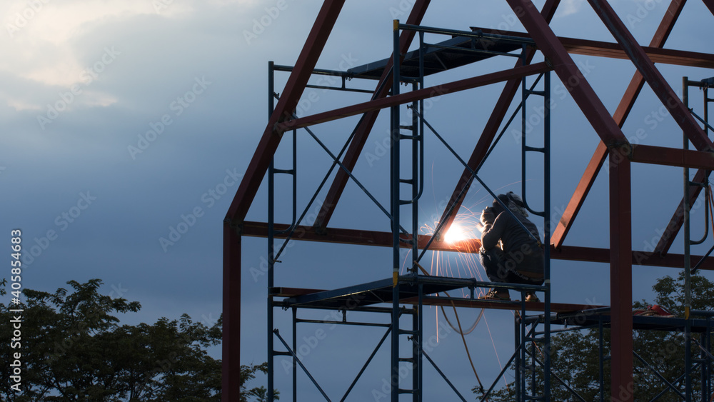 Welder working in work site.